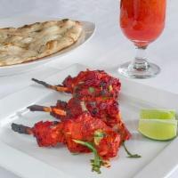 Tandoori Lamb Chops · Rack of lamb seasoned with herbs and spices, cooked in a clay oven till moist and tender.