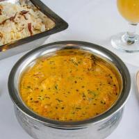 Paneer Korma · Cheese cubes cooked in Mughlai sauce made with butter, onions, and tomatoes seasoned with ga...