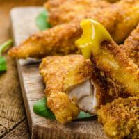 Lemon Pepper Chicken Tender Basket With Onion Rings · Delicious chicken tenders, tossed in Lemon Pepper sauce, and fried to perfection. Served on ...