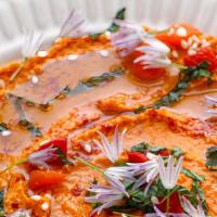 Roasted Red Pepper Hummus · Delicious dip made from chickpeas, blended with roasted red peppers.