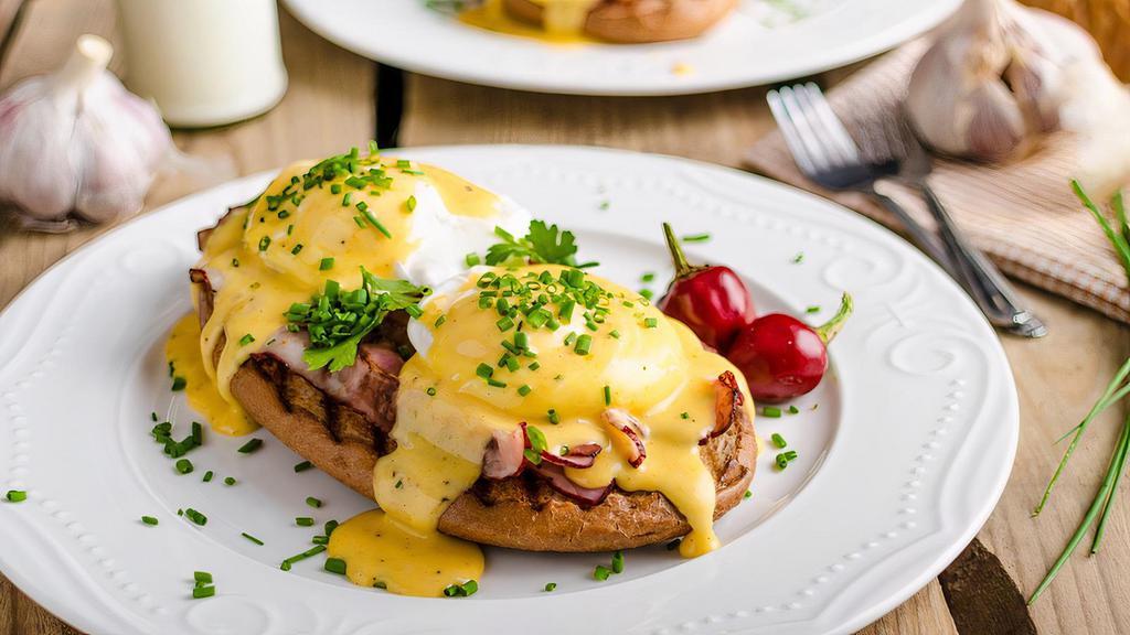 Eggs Benedict · Two Poached Eggs on a Toasted English Muffin with Canadian Bacon and Hollandaise Sauce.