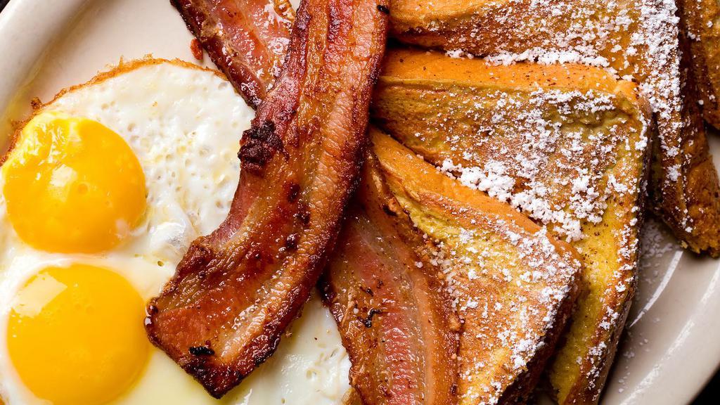 Dandy Breakfast French Toast · Delicious French toast cooked to perfection and served with Ham, Bacon, Sausage, Two cooked Eggs, and Home Fries.