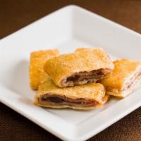 Rugelach Raspberry Bag · Sweet dough wrapped around just the right amount of raisins, walnuts, and jam - 10 pieces