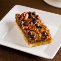 Pecan Turtle Bar Cookie · Caramel, pecans, and chocolate in a magical bar cookie.