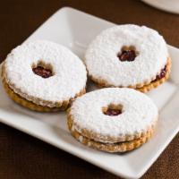 Linzer Tart · the classic Linzer cookie filled with ruby-red raspberry jam