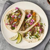 Carne Asada Taco · Create your Carne Asada taco with all-natural flank steak, your choice of Tributo toppings, ...