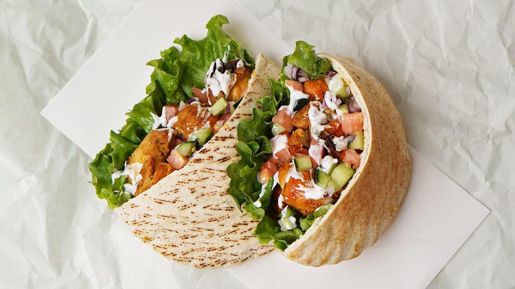 Chicken Kabob Pita With Everything · Everything consists of hummus, regular salad (lettuce, cucumber, tomato), pickled green cabbage, and spicy Turkish salad (tomatoes, onions and roasted red pepper).