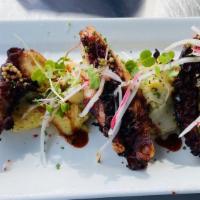 Crispy  Spanish Octopus · Gluten-free. Fingerling potato salad, mustard caviar, verjus glaze.