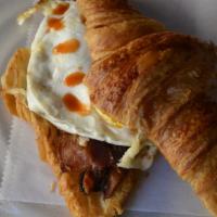 Egg Sandwich · Croissant, choice of either Bacon OR Avocado, fried egg, and aged cheddar.
