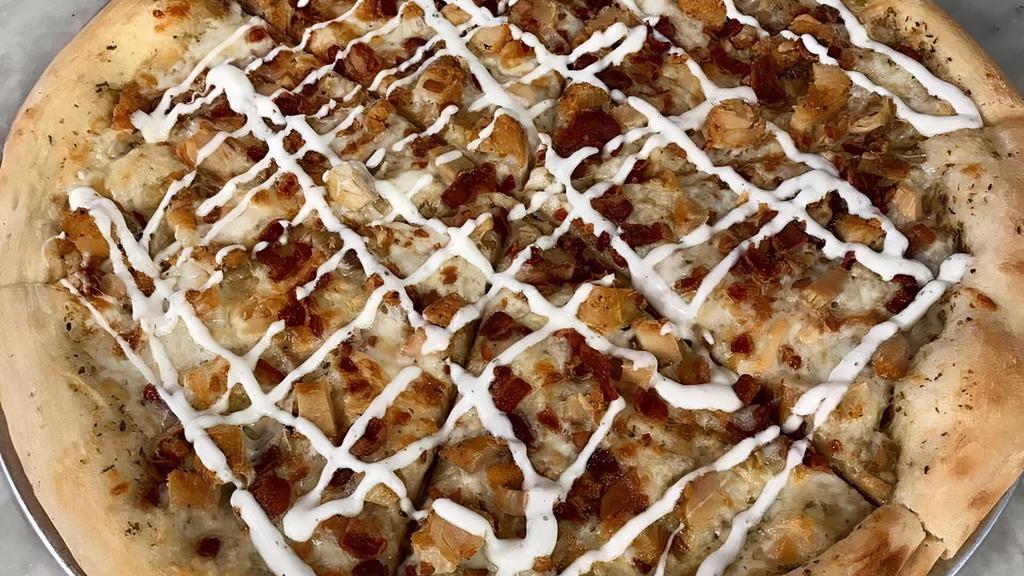 Chicken Bacon Ranch Pizza · NY Style Stone Baked Pizza with a Garlic base, topped with fresh Mozzarella, Bacon and Chicken. Then drizzled with Ranch.