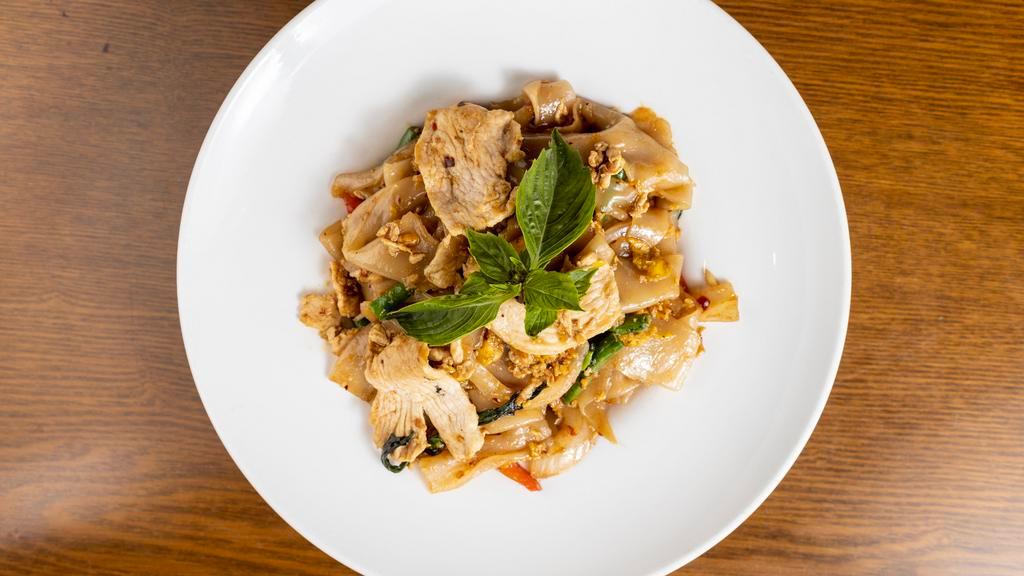 Drunken Noodles – “Pad Kee Mao” · Pad kee mao. Broad flat rice noodles sauteed with white onion, bell peppers, egg, chili peppers, and Thai basil. Spicy.
