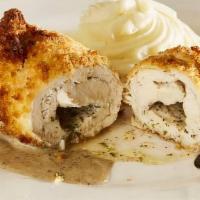 Chicken Kiev · Russian samovar's famous dish. Succulent, tender chicken breast stuffed with herbed butter, ...