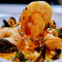 Tropical Seafood Stew · New. Salmon, Jumbo Shrimp, Mussels, Calamari, Coconut Habanero Broth. Served with Rice of Ch...
