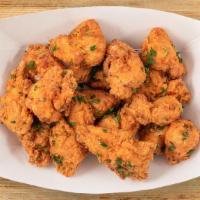 Large Crunchy Poppers (16 Pc) · 16 chicken poppers with your choice of three sauces.