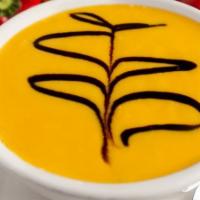 Carrot Ginger Soup · From the freshest ingredients. A blended puree drizzled with balsamic reduction.