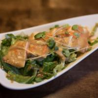 Tofu Salad · Vegetarian. Soft tofu with mixed greens and house made sesame dressing.