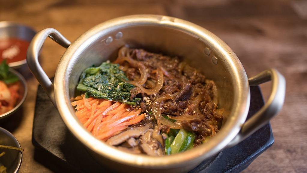 Bulgogi Bowl (Beef) · Traditional Korean ribeye rice bowl with shiitake mushrooms, carrots, zucchini. Served with gochu jang sauce.