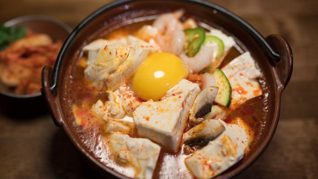 Soon Doo Boo Soup · Traditional spicy soft tofu soup with onions, zucchini, and egg inside.