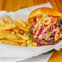 Galbi Burger · Marinated with traditional galbi flavor served with ginger slaw and carrots. Topped with spi...