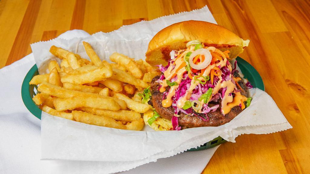 Galbi Burger · Marinated with traditional galbi flavor served with ginger slaw and carrots. Topped with spicy mayo.