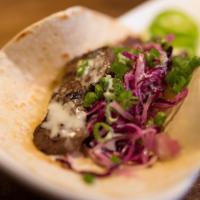 Galbi Taco · Premium short rib beef marinated in traditional galbi sauce with fresh ginger cabbage slaw, ...