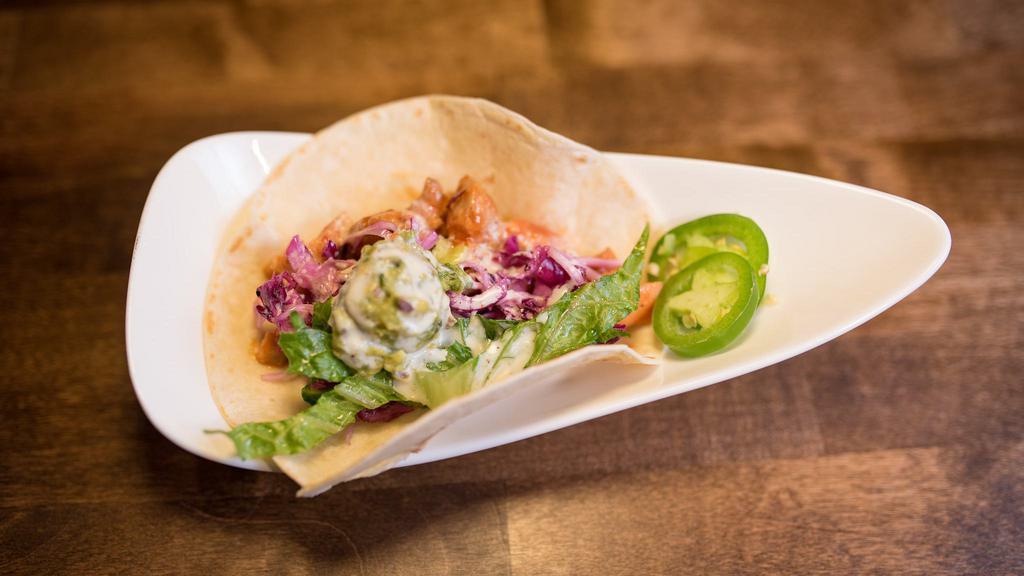 Bul Dak Taco · Spicy chicken, guacamole, lettuce, cabbage slaw, carrots, and house-made kiwi sauce. Single serving.