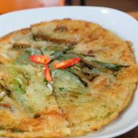 Pajeon · Thin crispy Korean pancake. Choice of kimchi, seafood, or scallion.