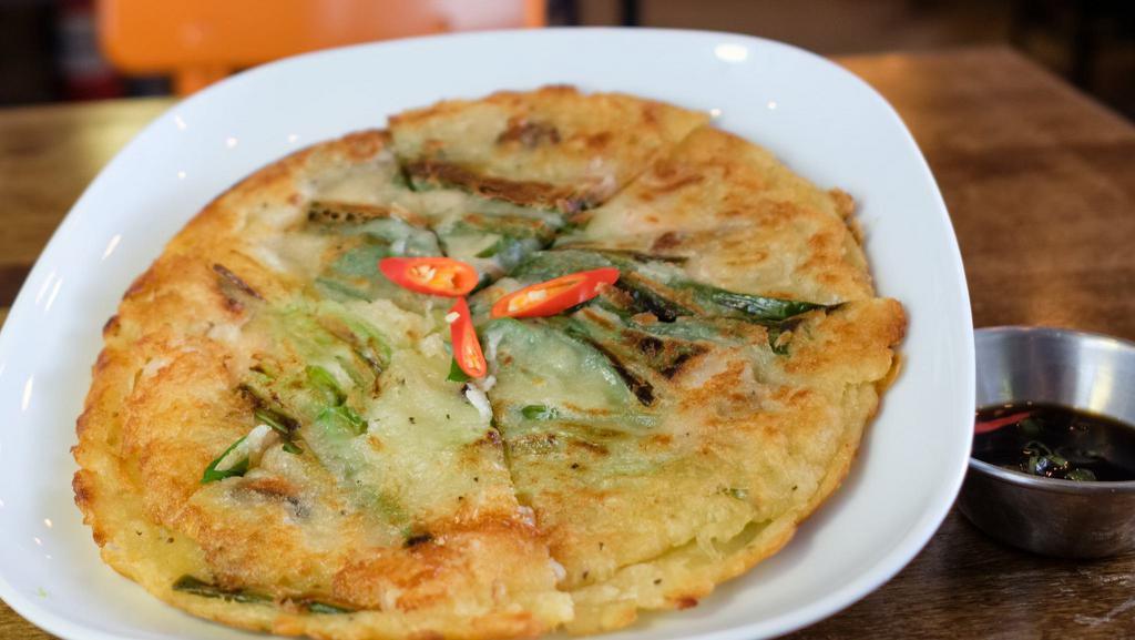 Pajeon · Thin crispy Korean pancake. Choice of kimchi, seafood, or scallion.