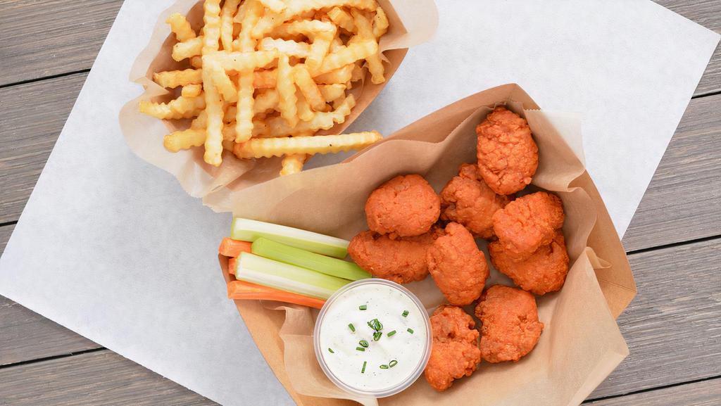 9 Crispy Boneless Wings Combo · 9 Crispy boneless chicken wings tossed in 1 wing flavor and served with fresh carrot & celery sticks and homemade buttermilk ranch or blue cheese dressing + Fries