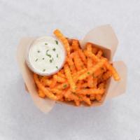 Buffalo Fries · Crispy crinkle cut fries tossed in buffalo sauce served with ranch or blue cheese dipping sa...