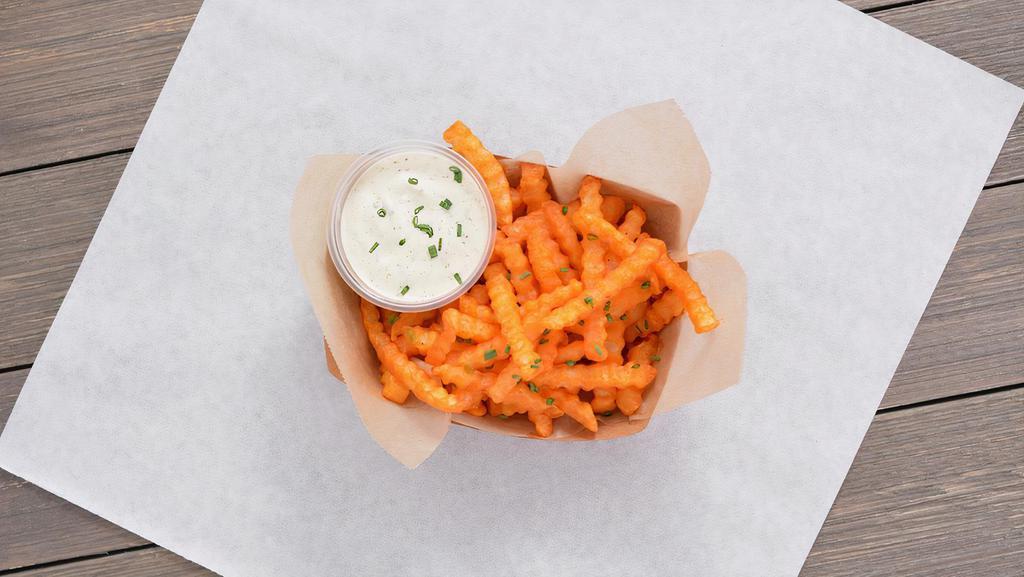 Buffalo Fries · Crispy crinkle cut fries tossed in buffalo sauce served with ranch or blue cheese dipping sauce..