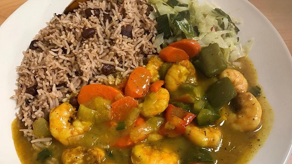 Curried Shrimp Meal · Shrimp cooked in a spicy curry sauce served over Rice & Peas or Basmati Rice;  Cucumber and Tomato, Steam Cabbage.