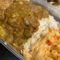 Curried Chicken · Chicken in a medium curry sauce served over Rice & Peas or Basmati Rice; Steamed Cabbage; to...