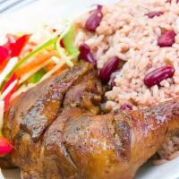 Jerk Chicken Dinner · Chicken marinated in jamaican jerk seasoning and slow roasted. All meals served with rice an...