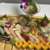 Salmon Lover · Four pieces salmon sushi, eight pieces salmon sashimi, with spicy crunchy salmon roll.