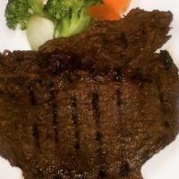 Bistec A La Parrilla · Grilled steak.