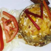 Mofongo De Queso · Mashed green plantains with cheese.