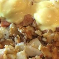 Nova Scotian Benedict · Smoked Salmon, Red Onion, & Poached Eggs, On an English Muffin. Topped with hollandaise sauc...