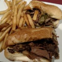 Philly Cheesesteak · Shaved Steak, Onions, Mushrooms, Peppers, & American Cheese