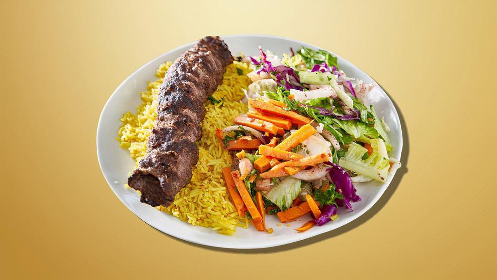 Feast Kabob Plate · Two lamb skewers and one veggie skewer. Served over rice and cucumber salad with pita bread, a side of tahini sauce, and a side of hot sauce.