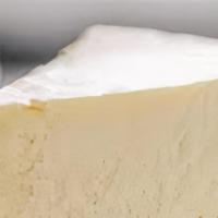 Slice Of Cheesecake · A thick layer of a mixture of soft, fresh cream cheese, eggs, and sugar.