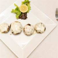 Stuffed Mushrooms · Baked stuffed mushrooms with our own special crab meat stuffing.
