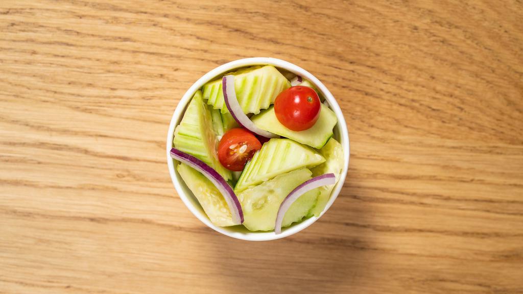 Cucumber Salad · Vegan, gluten free. Cucumber, red onion and cherry tomato.
