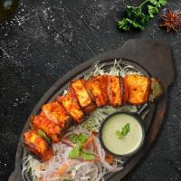 Cottage Cheese Tikka · Tender pieces of Cottage cheese marinated with delicate spices and roasted in tandoor.
