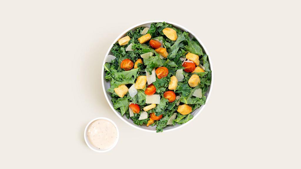 Kale Caesar · Chopped kale with fresh Parmesan, croutons, chopped tomatoes, and Caesar dressing.