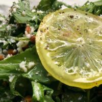 Arugula Salad · The classic you love. Farmer fresh arugula, zingy house preserved lemon, dusted with Parmesa...