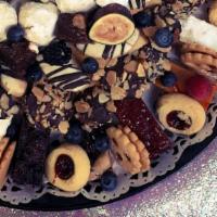 Cookies & Brownies Medley ( Per Person ) · Assortment of home baked butter cookies, fruit bars, square desserts and brownies garnished ...