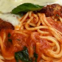 Chicken Parmigiana (Argentina) · Chicken breast topped with tomato sauce and mozzarella served with spaghetti.
