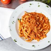 Strozzapreti Al Ragu Di Vitello (Emilia Romagna) · Twisted fresh pasta in creamy veal ragu. 