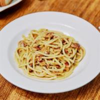 Bucatini Alla Carbonara (Rome) · Thick spaghetti served with pancetta, pecorino, Parmigiano, black pepper and finish with an ...